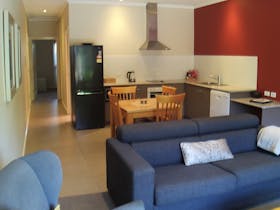 Fully self contained, contemporary living area of the One Bedroom Apartment