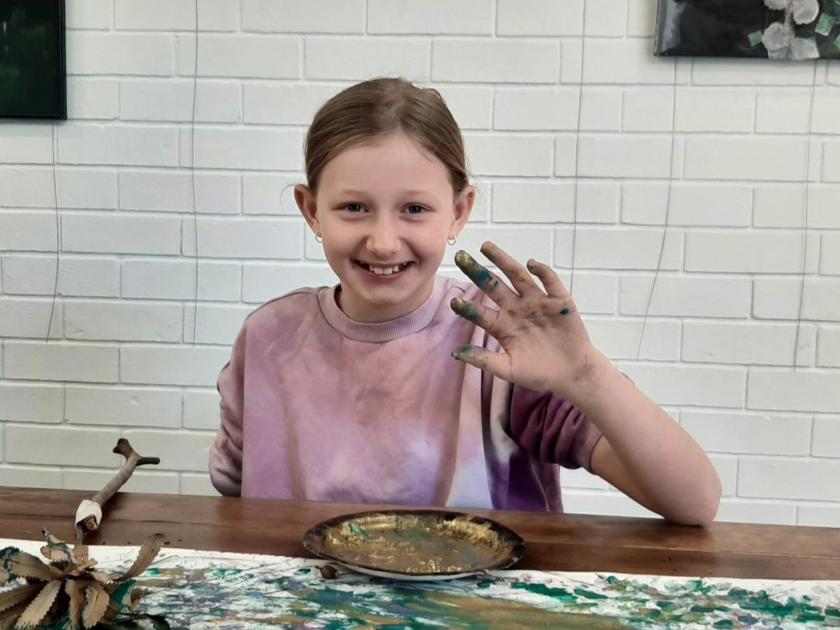 Child with paint on hands