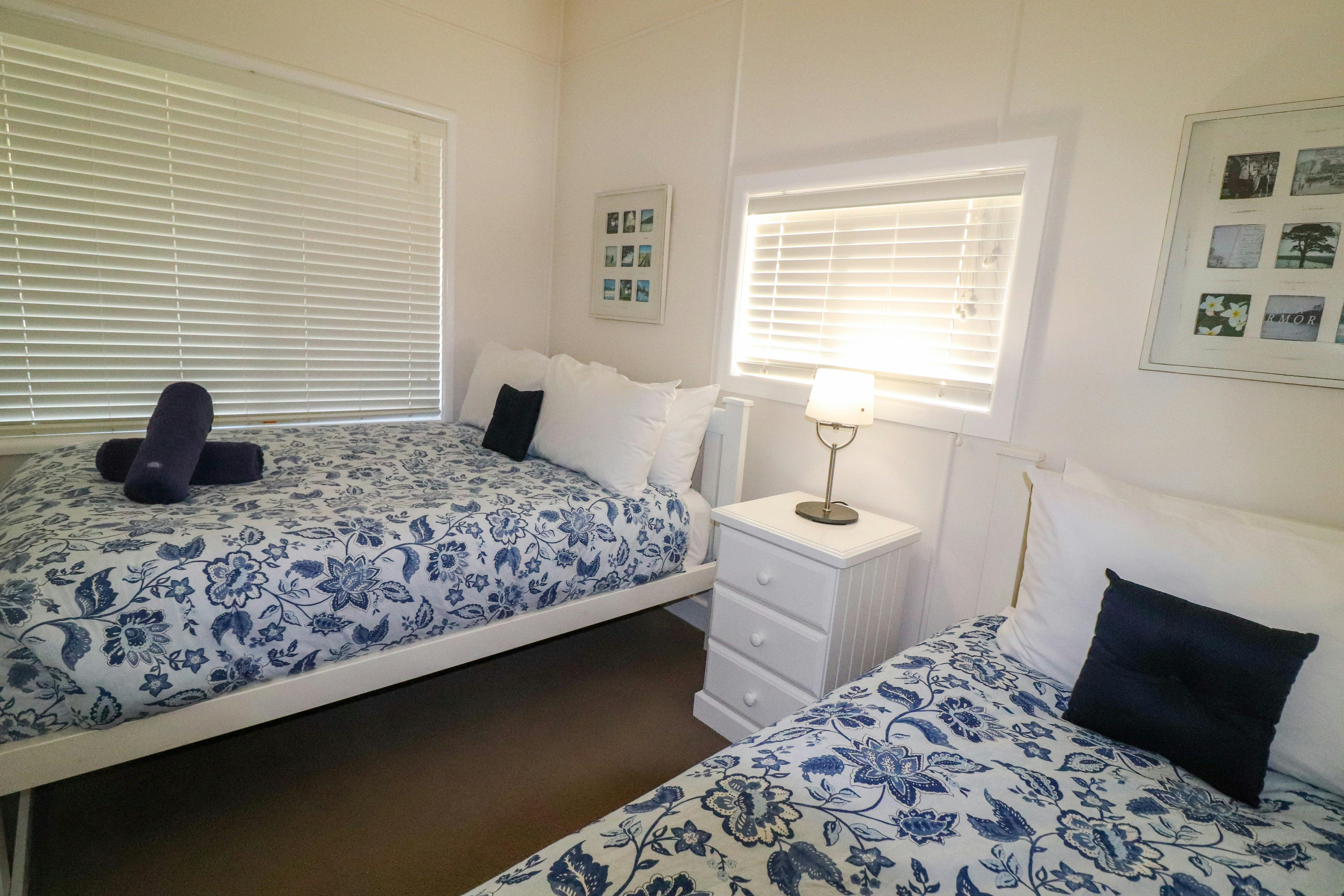 The second bedroom features a double bed and a single bed
