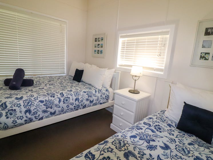 The second bedroom features a double bed and a single bed