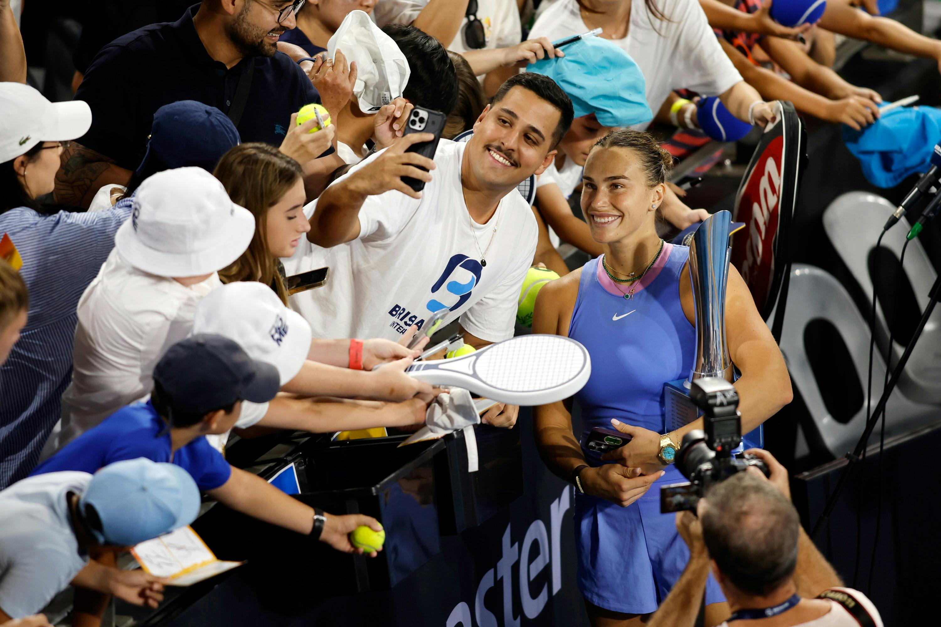 Fan taking a selfie with  tennis player Aryna Sabalenka at the 2025 Brisbane International.