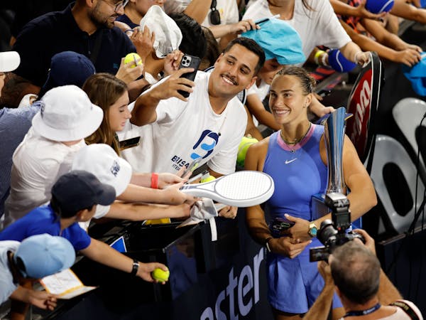Fan taking a selfie with  tennis player Aryna Sabalenka at the 2025 Brisbane International.