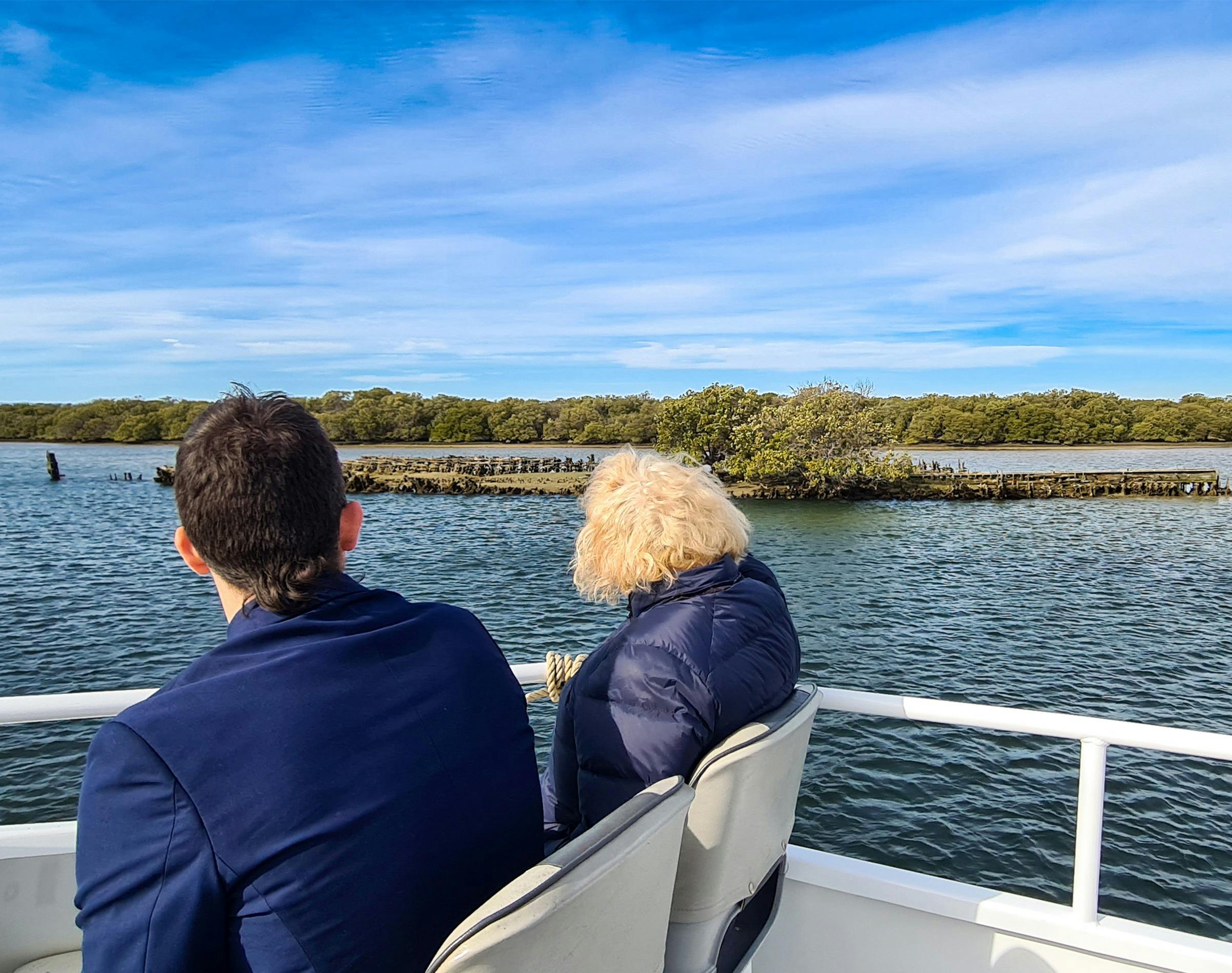 Two passengers enjoy the sights of a sunken vessel up close