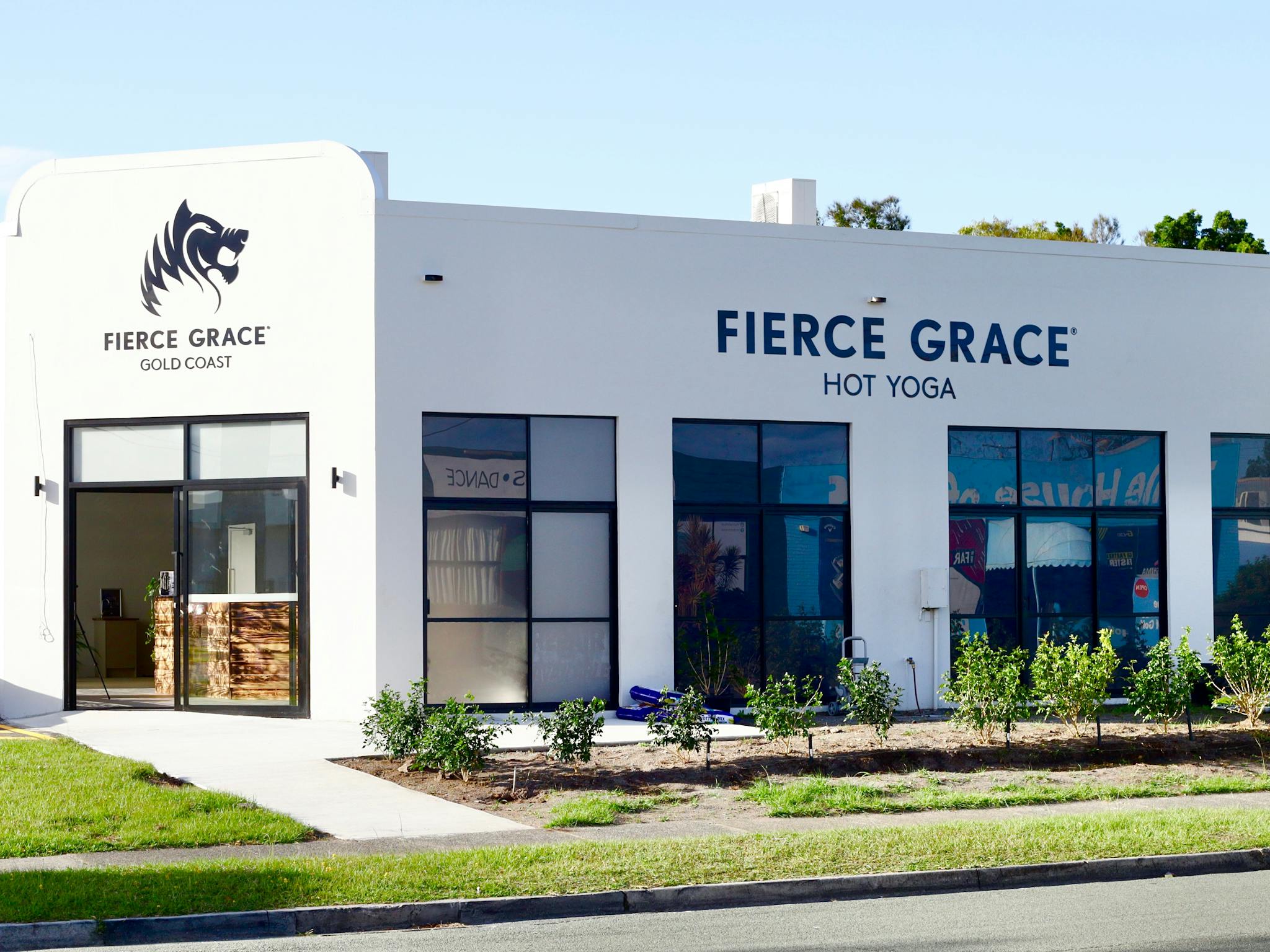 Studio Exterior Shot. Grey building with Fierce Grace branding Studio Exterior Shot. Grey building with Fierce Grace branding