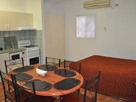 main bed dining area and kitchen