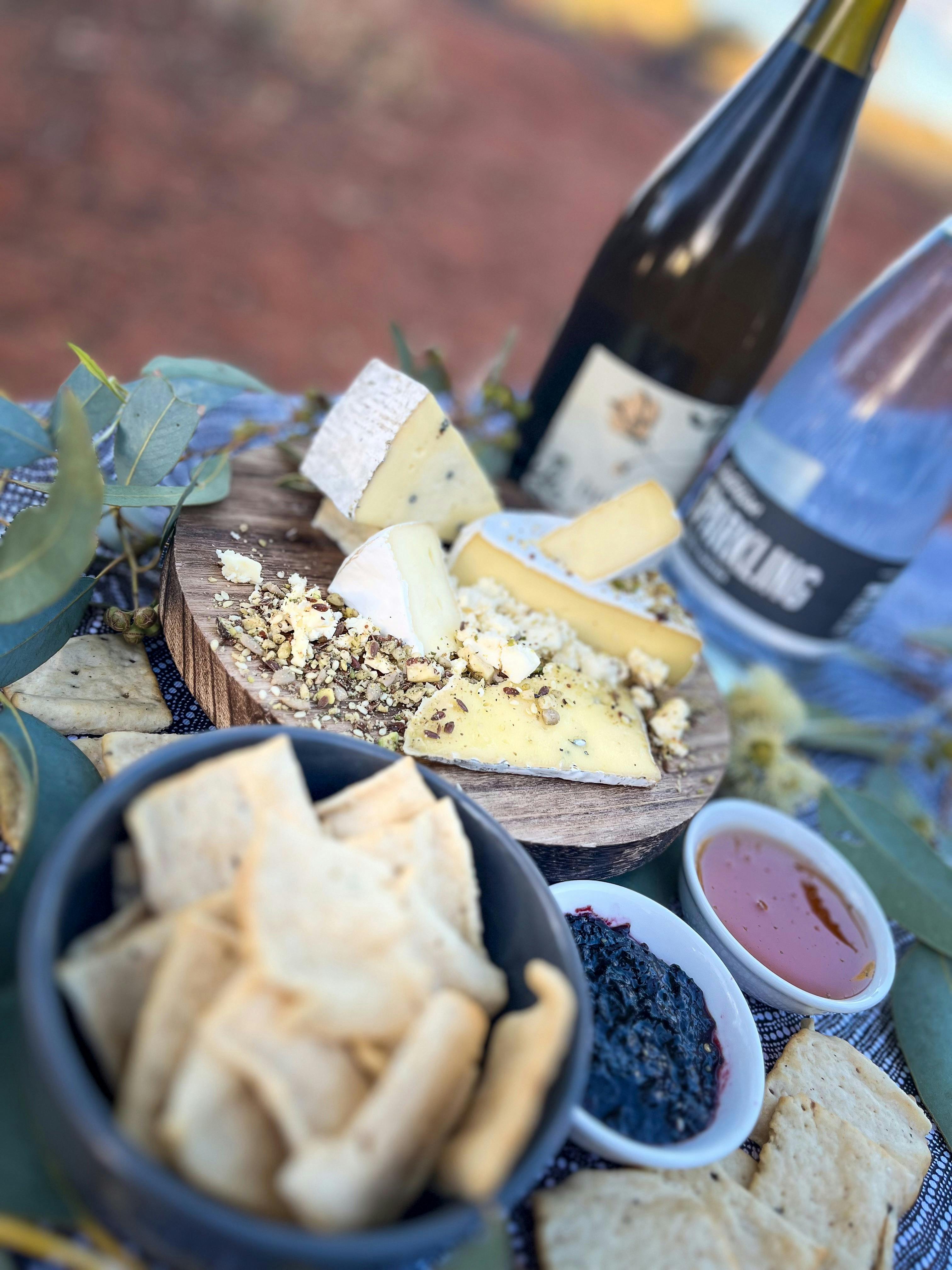 Hamper contents, cheess, crackers, jam, honey and dukkah