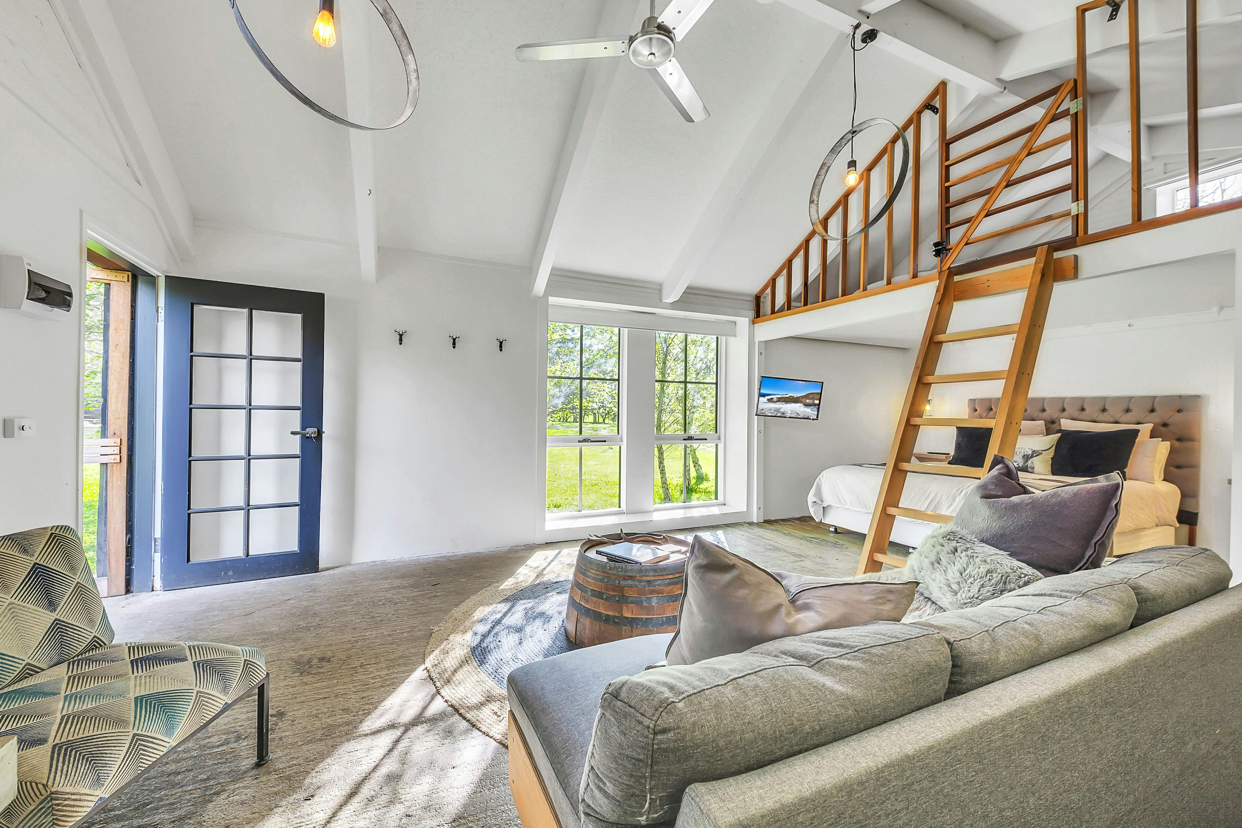 entry doorway and window, couch and ladder