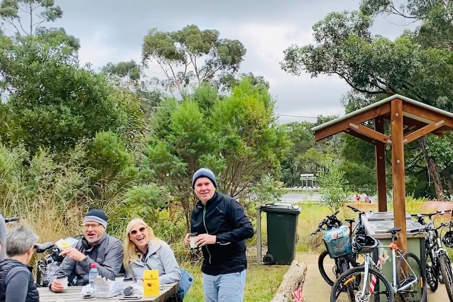 Enjoying a lunch time picnic at the beginning of the red hill rail trail on a cycling vine tour