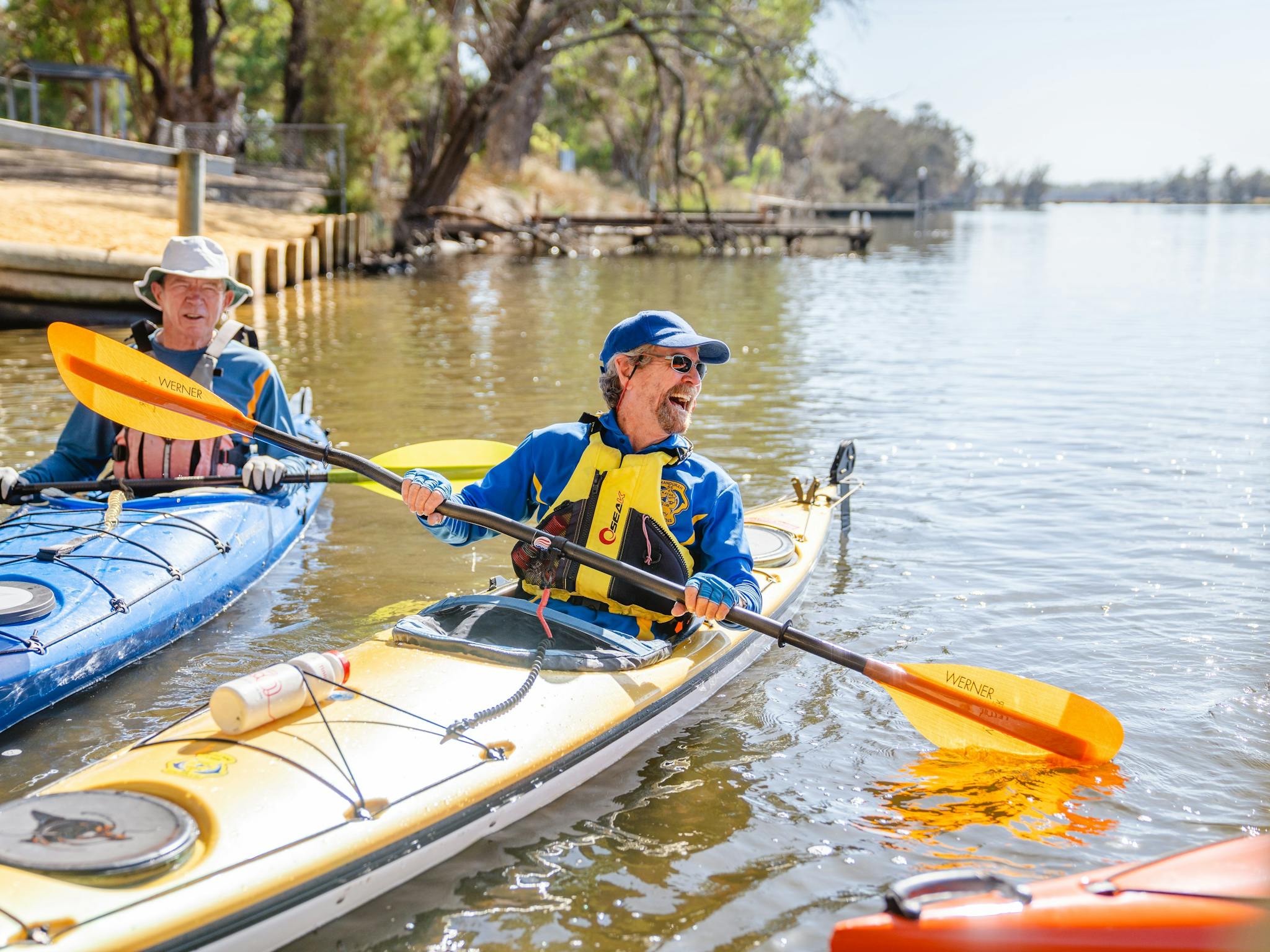 Two kayakers close to Riverside Gardens launch.