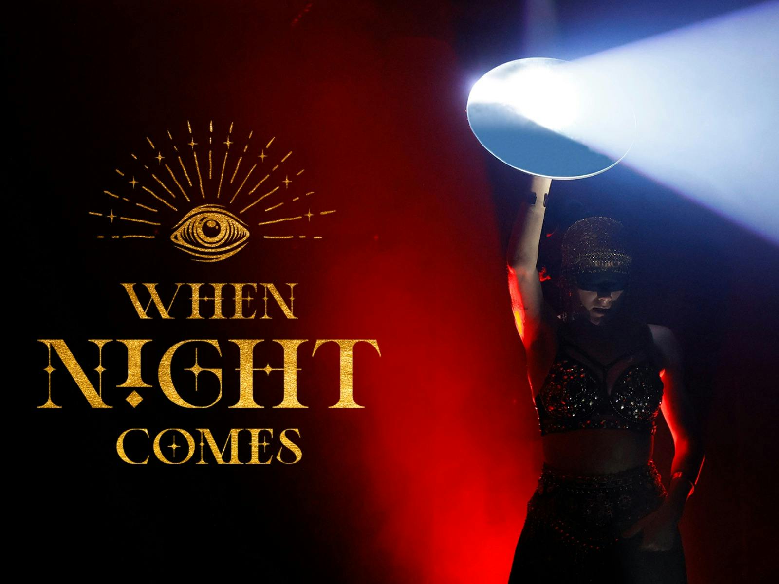 A beam of light reflects off a mirror being held by a woman wearing a blindfold