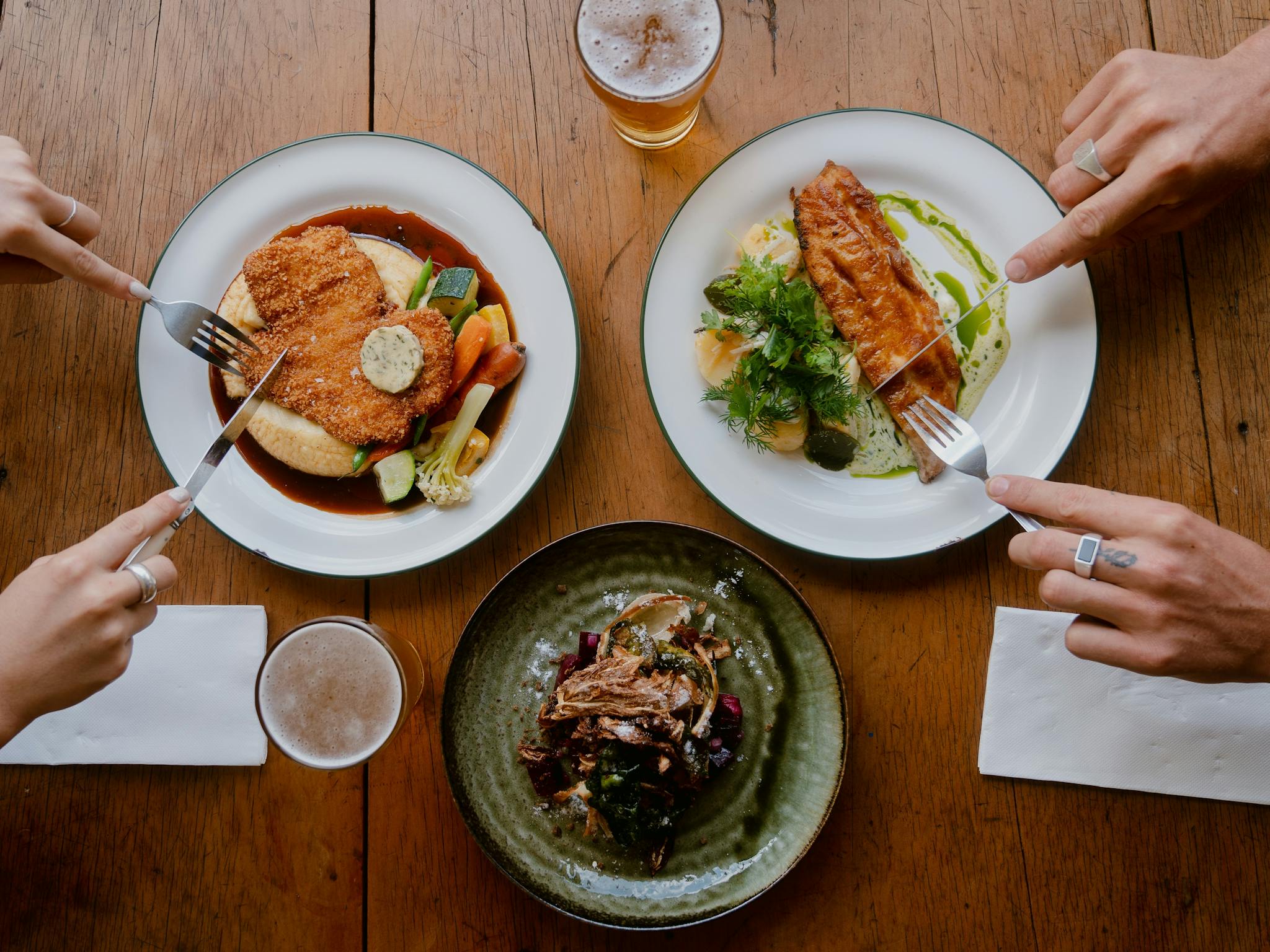 3 plated of food on a table 3 plated of food on a table