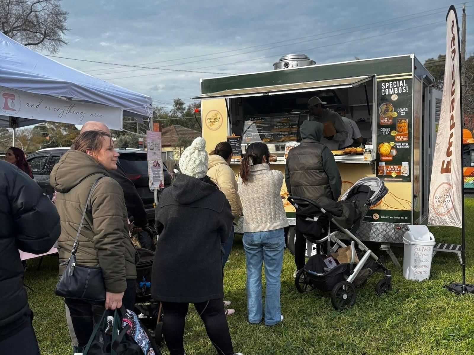People lined up at a food truck