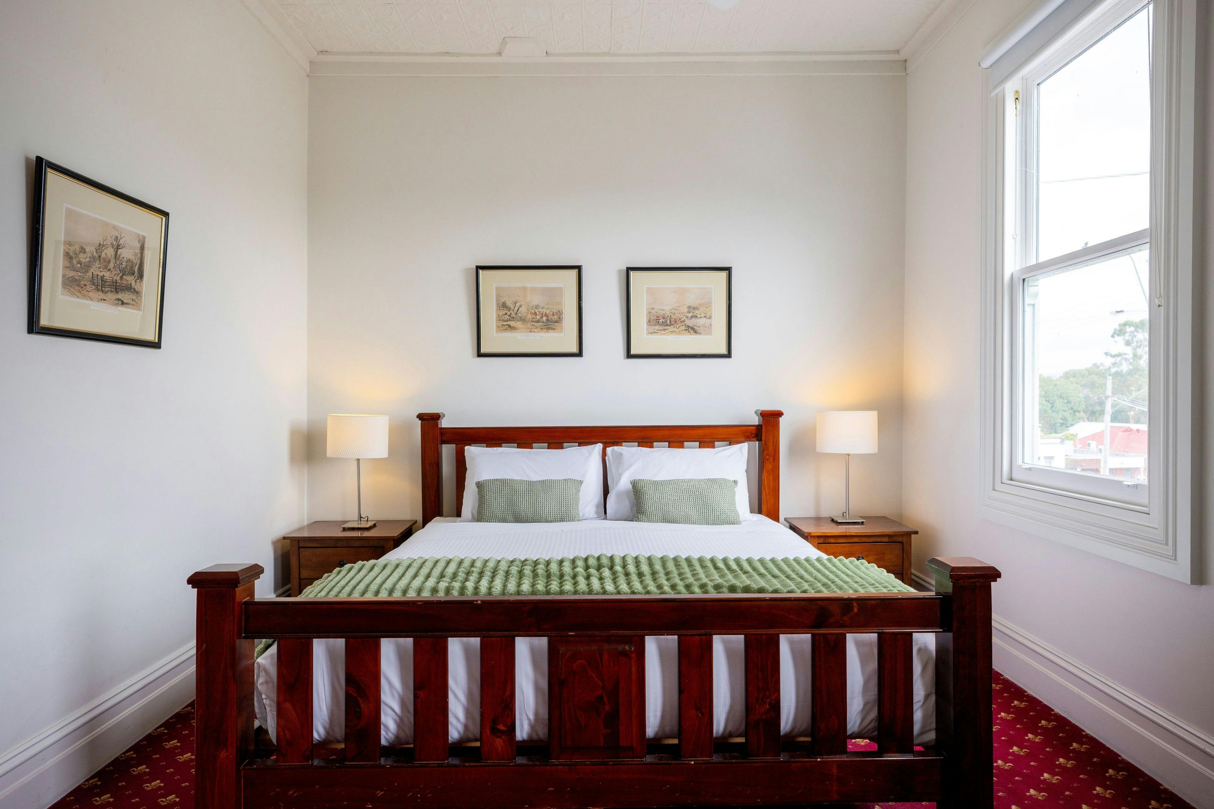 Big king bed with private ensuite, upstairs at The Corner Hotel Alexandra