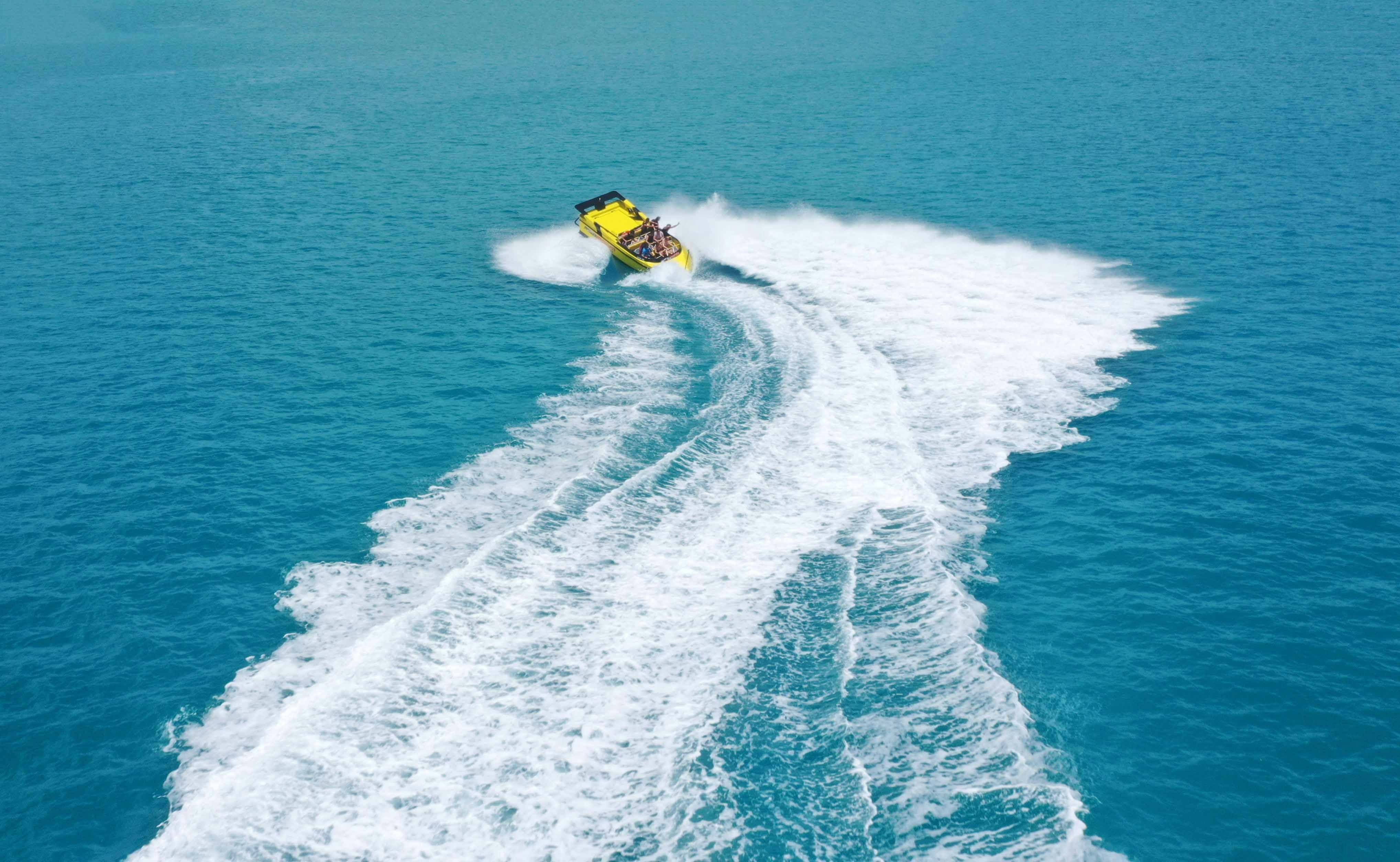 aerial image of jet boat moving at speed