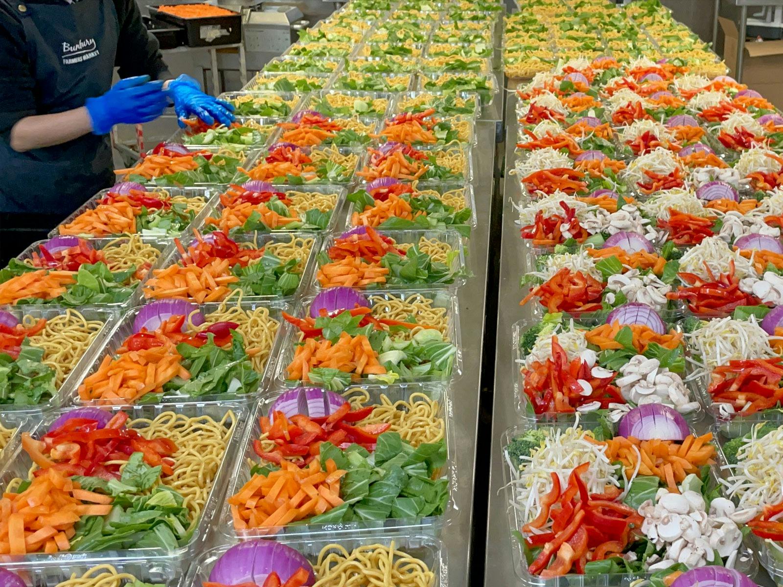 Stir fry packs being prepared and packed in the kitchen at Bunbury Farmers Market