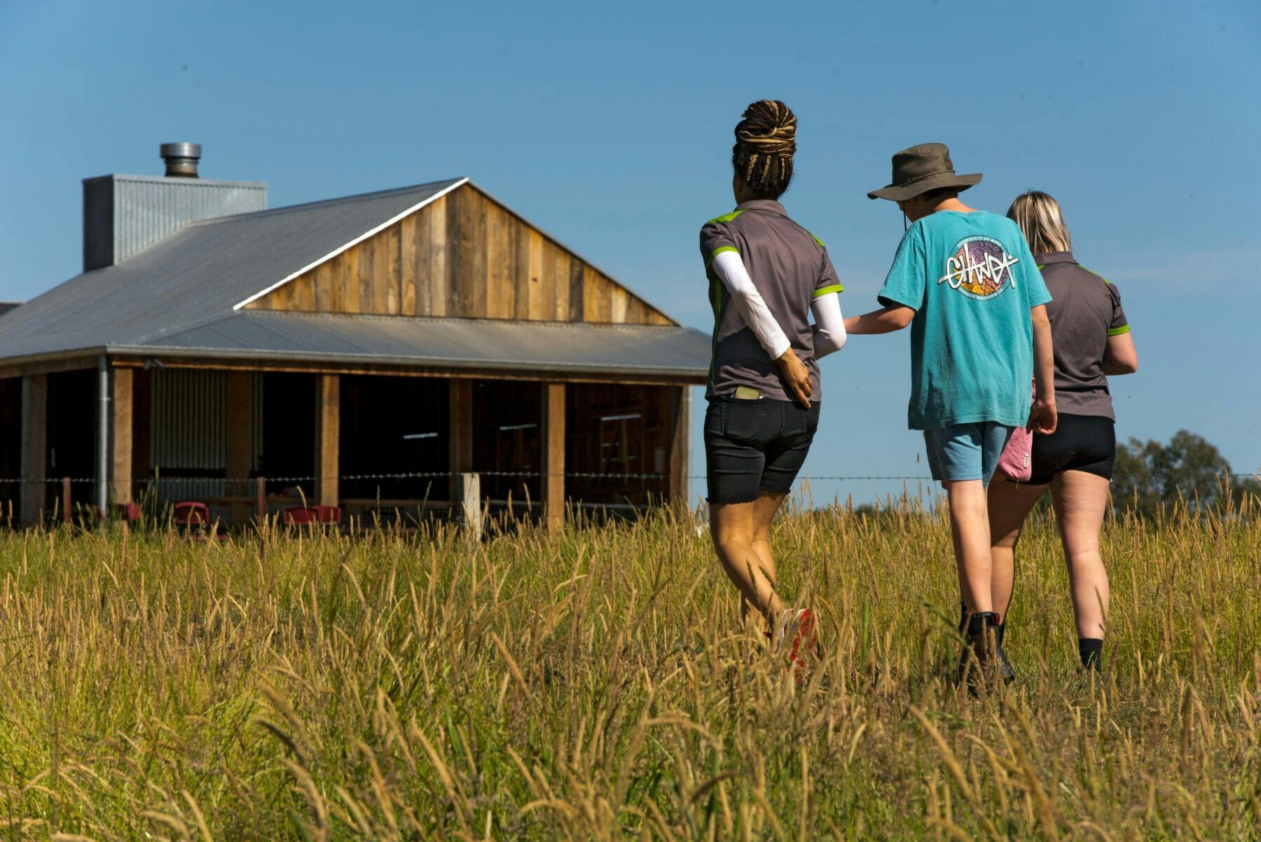 people walking to the meeting hut
