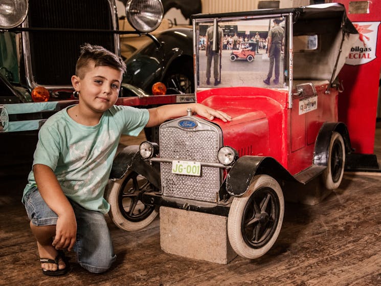 boy sitting with vintage truck toy at the Federation Museum Corowa