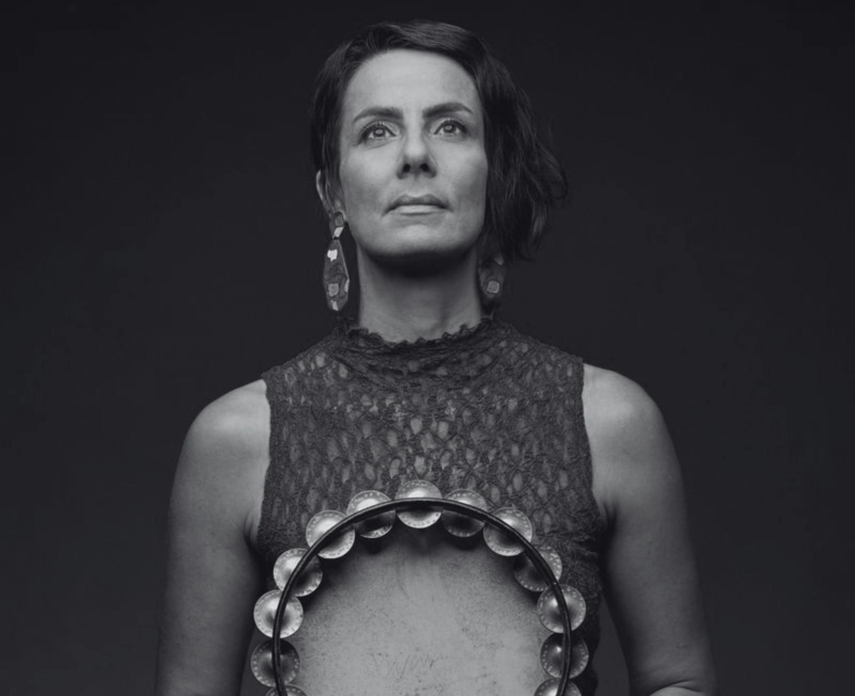 Claire Edwardes holding a tambourine