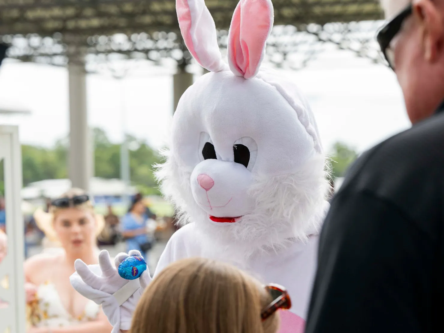 easter bunny holding an easter egg