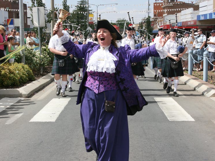 The town cryer leads the parade