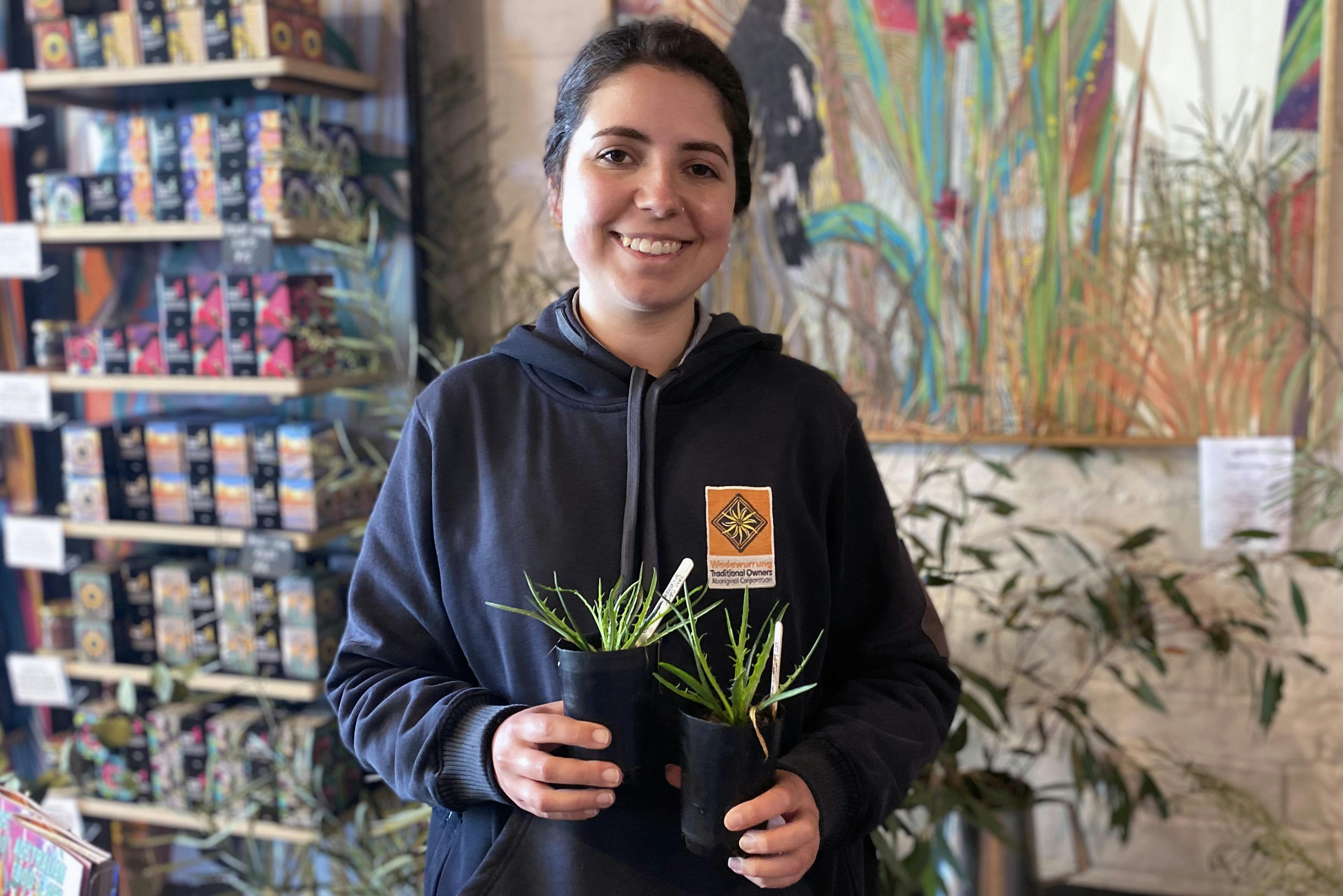 Woman holding plants