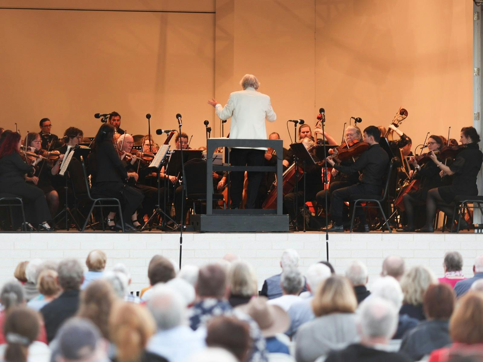 The Lake Macquarie Philharmonic Orchestra performing on stage