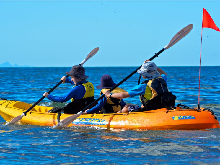 Three children in kayak