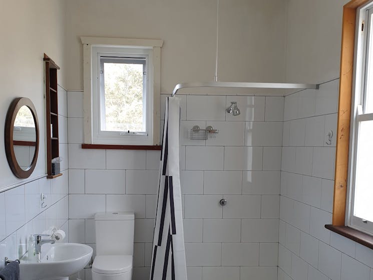 White-tiled bathroom with shower