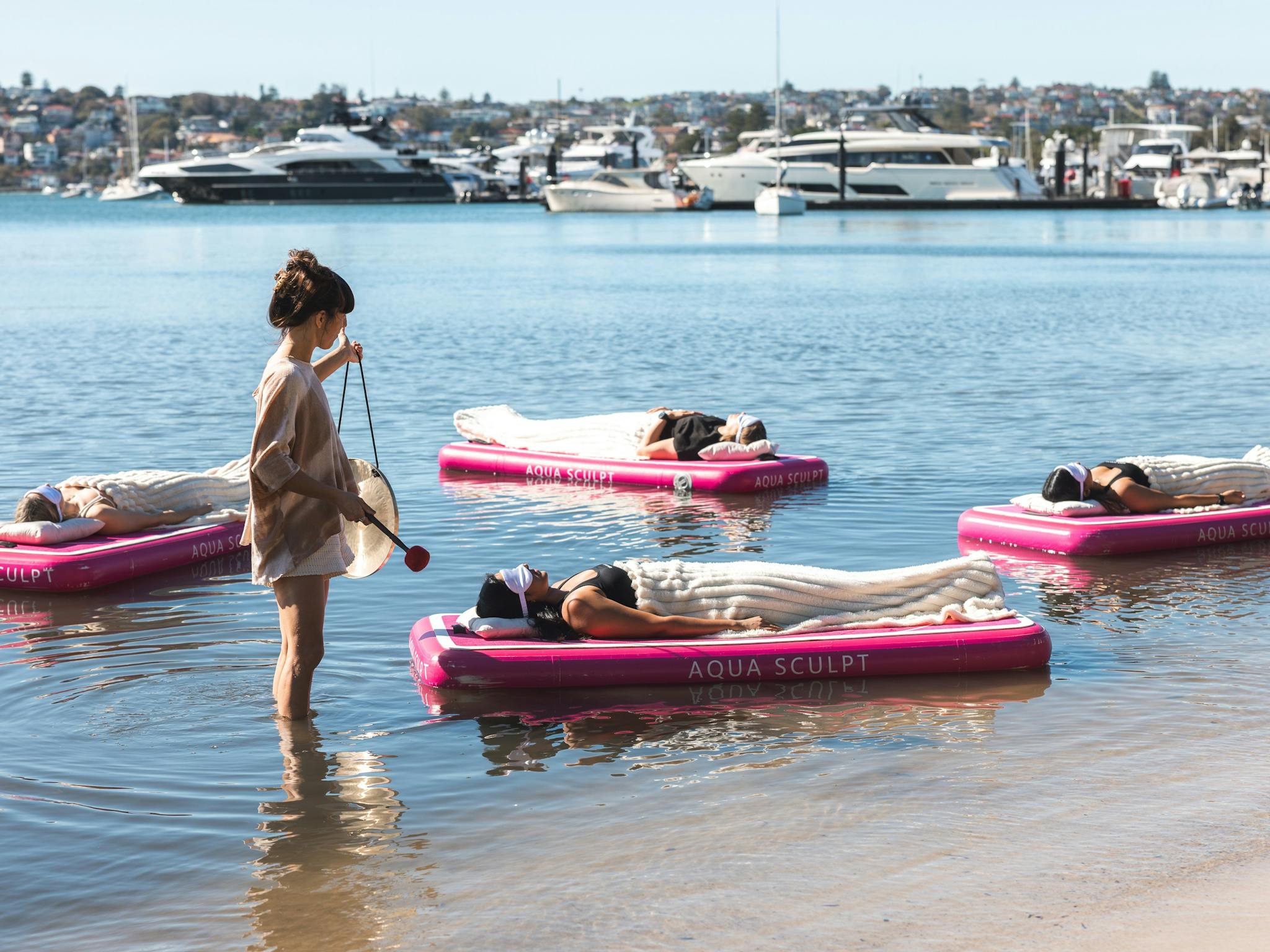 A family of 6 enjoying a private group session and floating sound bath in Sydney