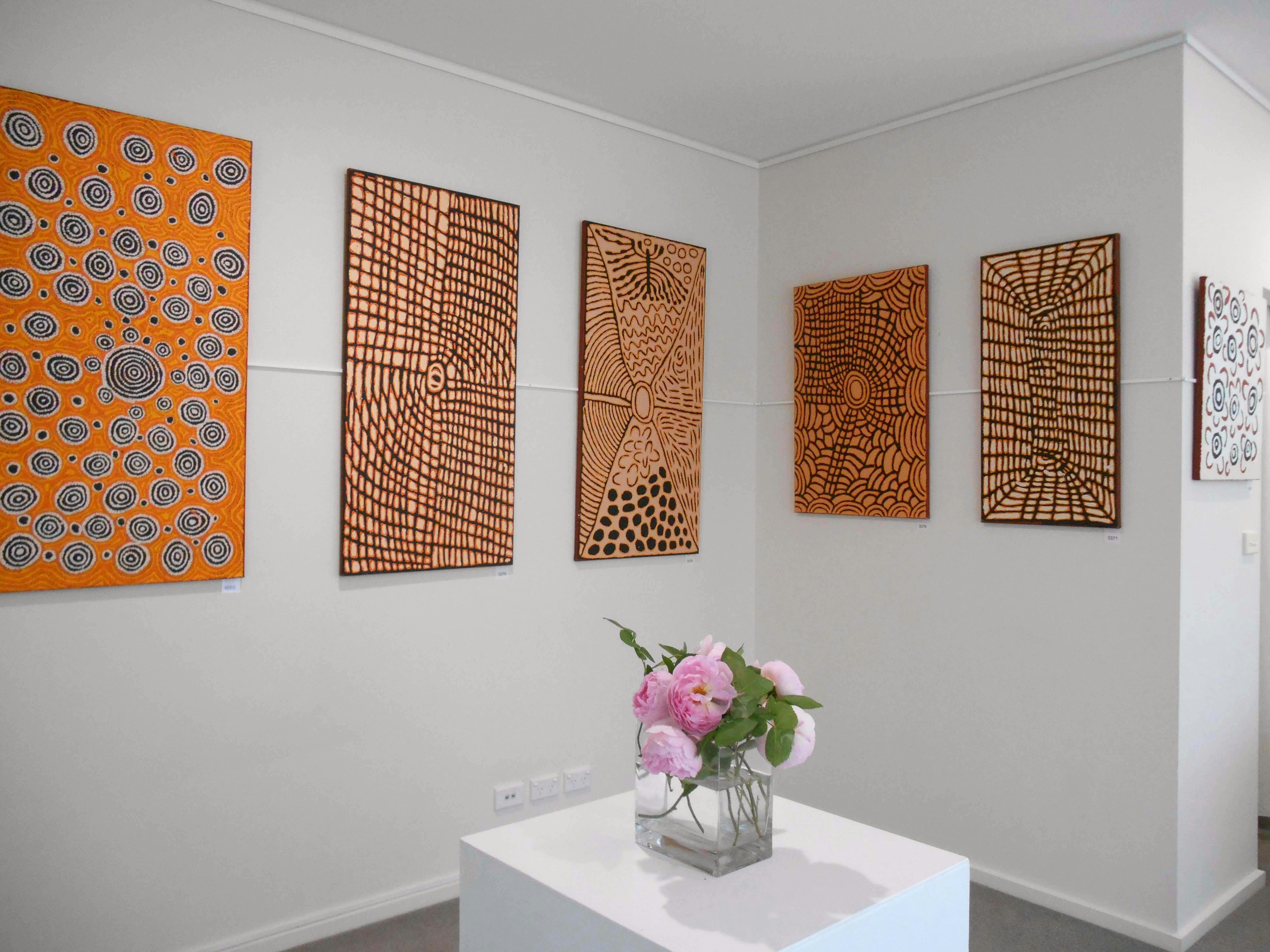 Aboriginal art paintings by Papunya Tula Artists on exhibition at Artworld ADG