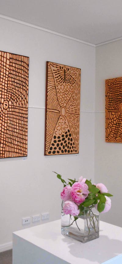 Aboriginal art paintings by Papunya Tula Artists on exhibition at Artworld ADG
