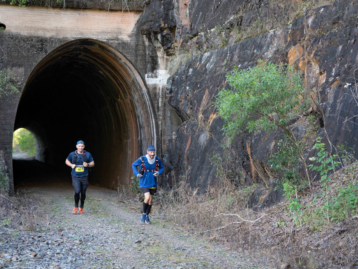 Runners through tunnels