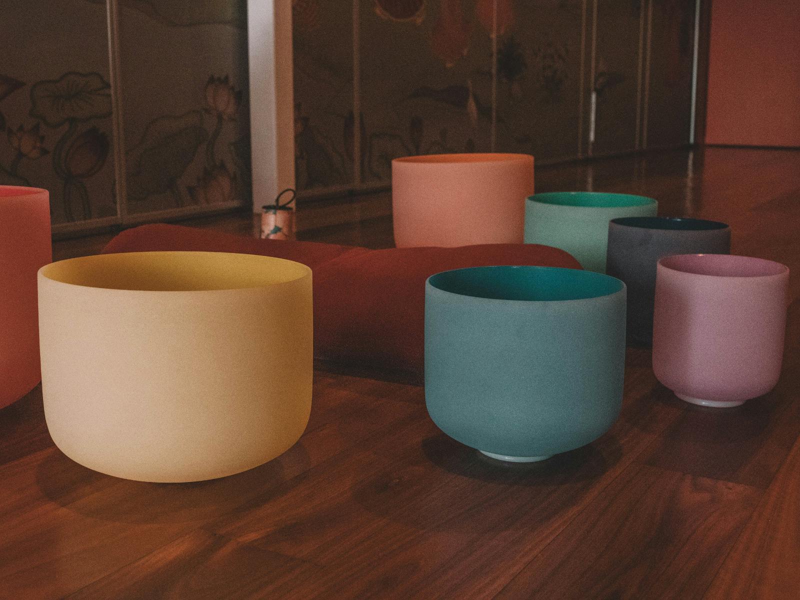Photo of colourful crystal sound bowls