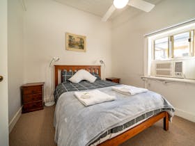 Bedroom 2 features a Queen bed