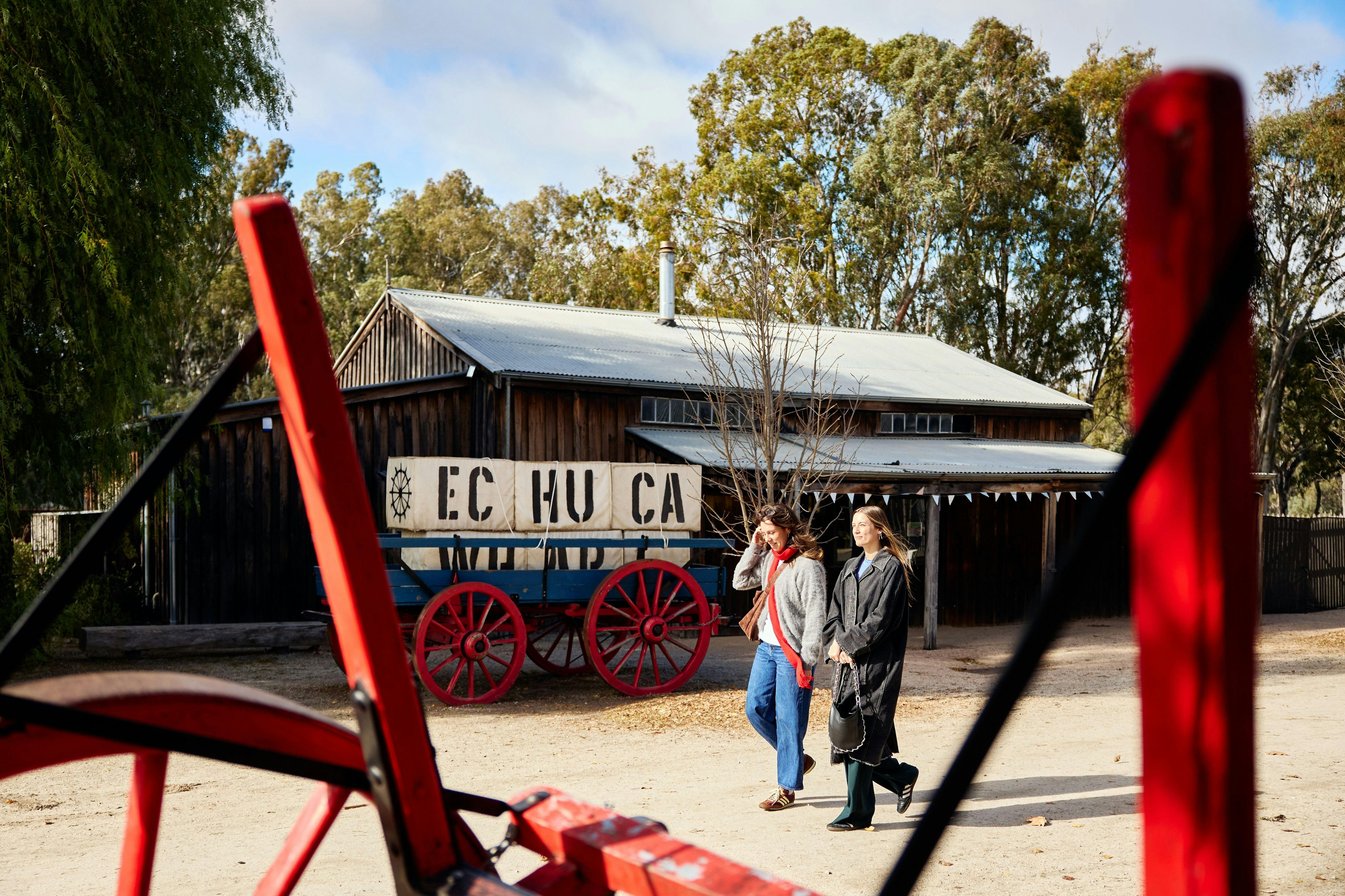 2 ladies walking along the port of echuca
