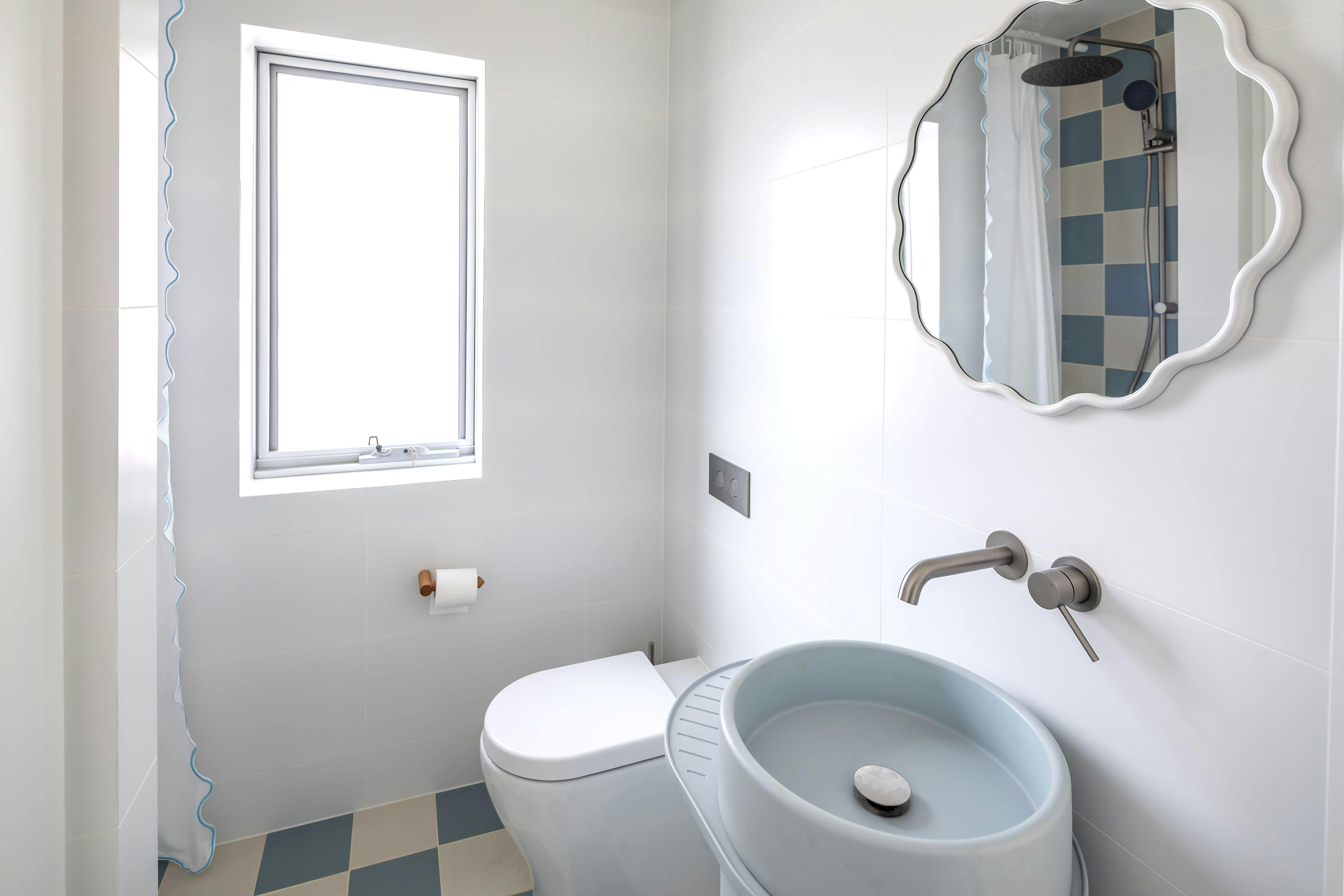 Downstairs bathroom with a shower and toilet