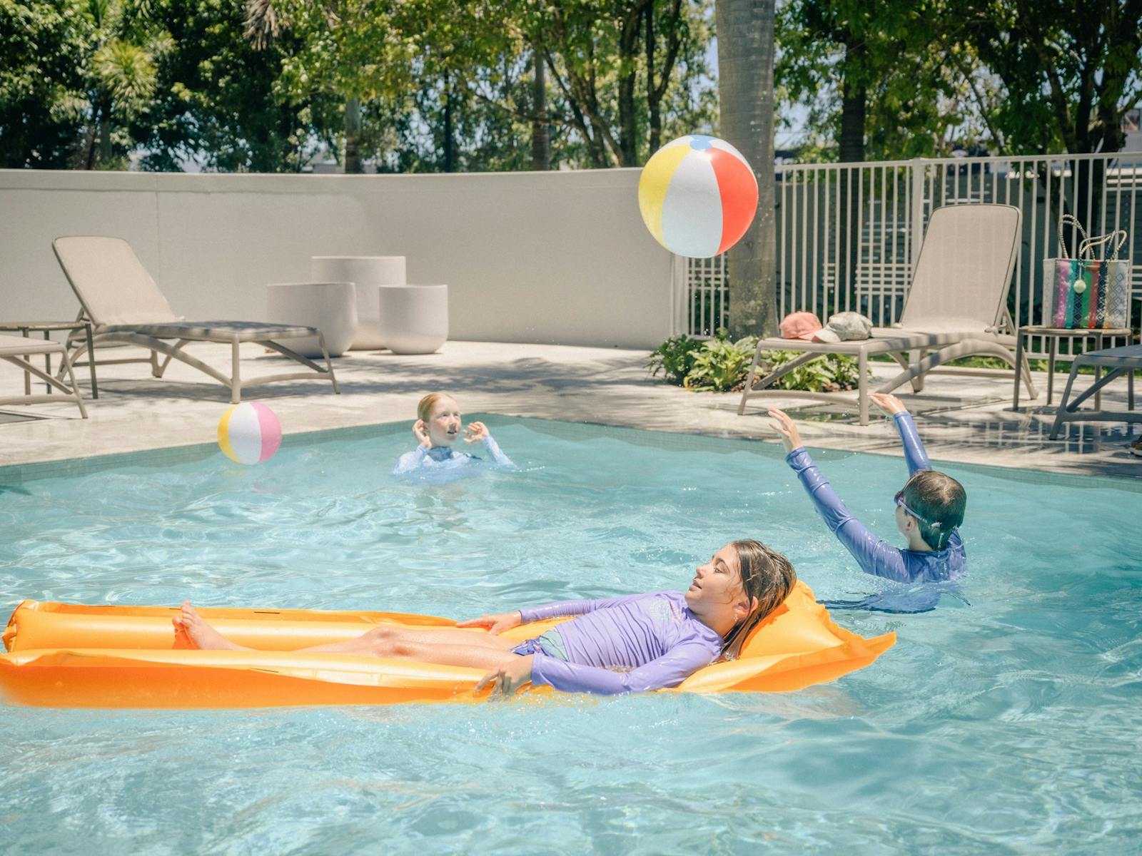 Children having fun in the pool