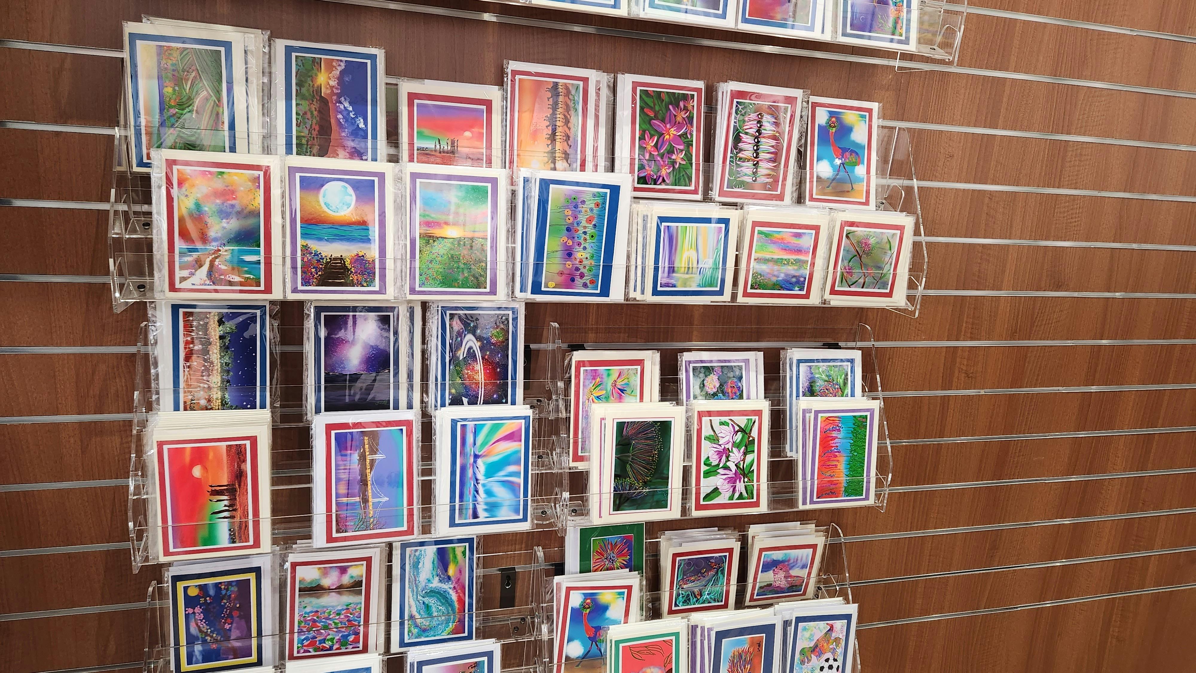 Different designs of Greeting cards display on a rack