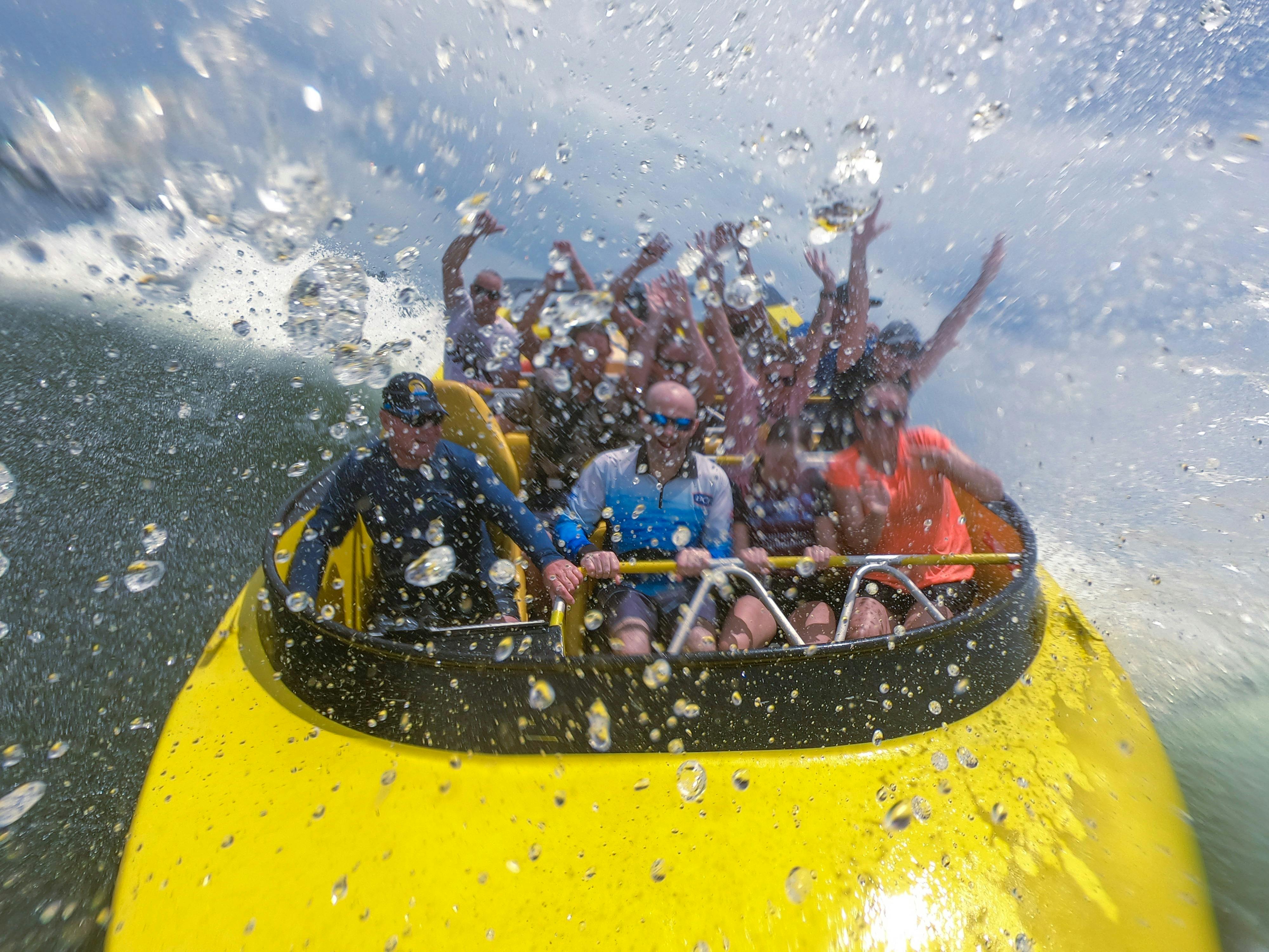 Passengers enjoying jet boat ride