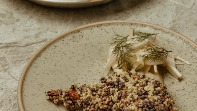 twice cooked quail, puffed grains, pickle fennel
