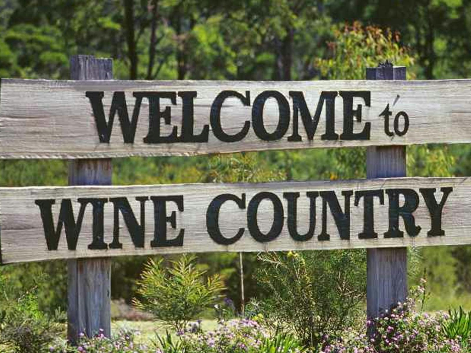 A welcome to wine country sign