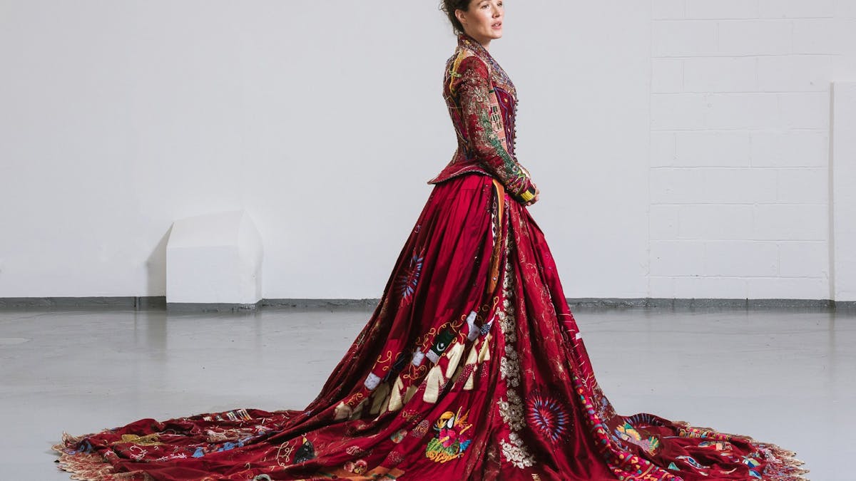 A women wearing a full embroidered red dress