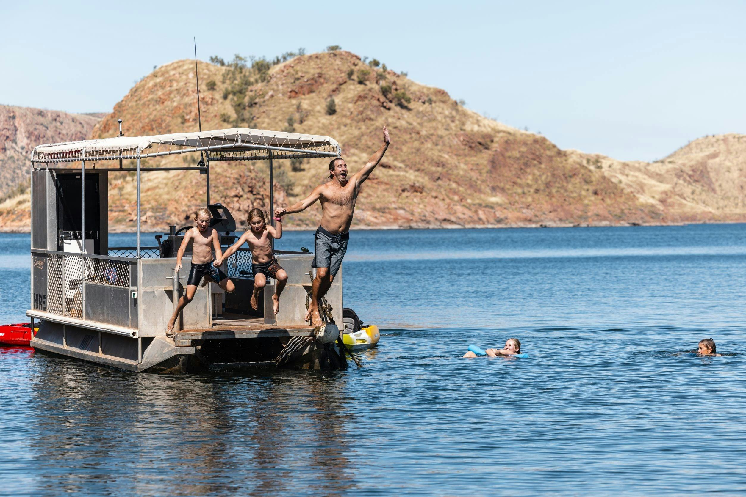 Family enjoying BBQ Pontoon on Lake Argyle
