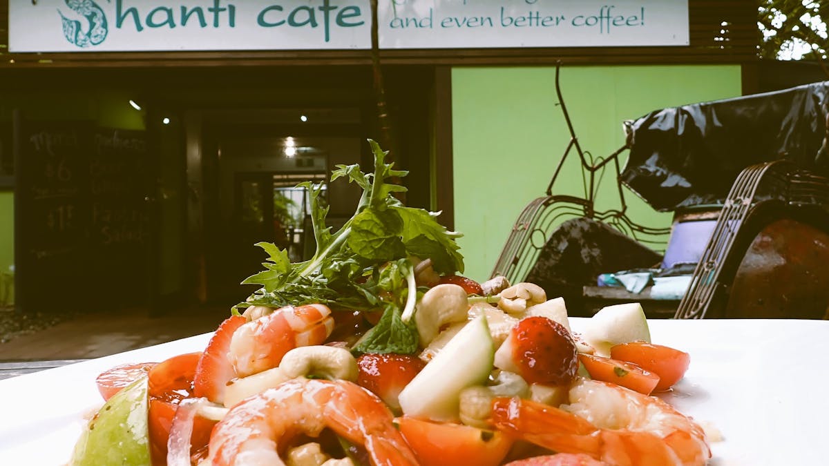 Thai Prawn Salad with rickshaw and cafe entrance , Shanti Cafe, Mission Beach, Queensland