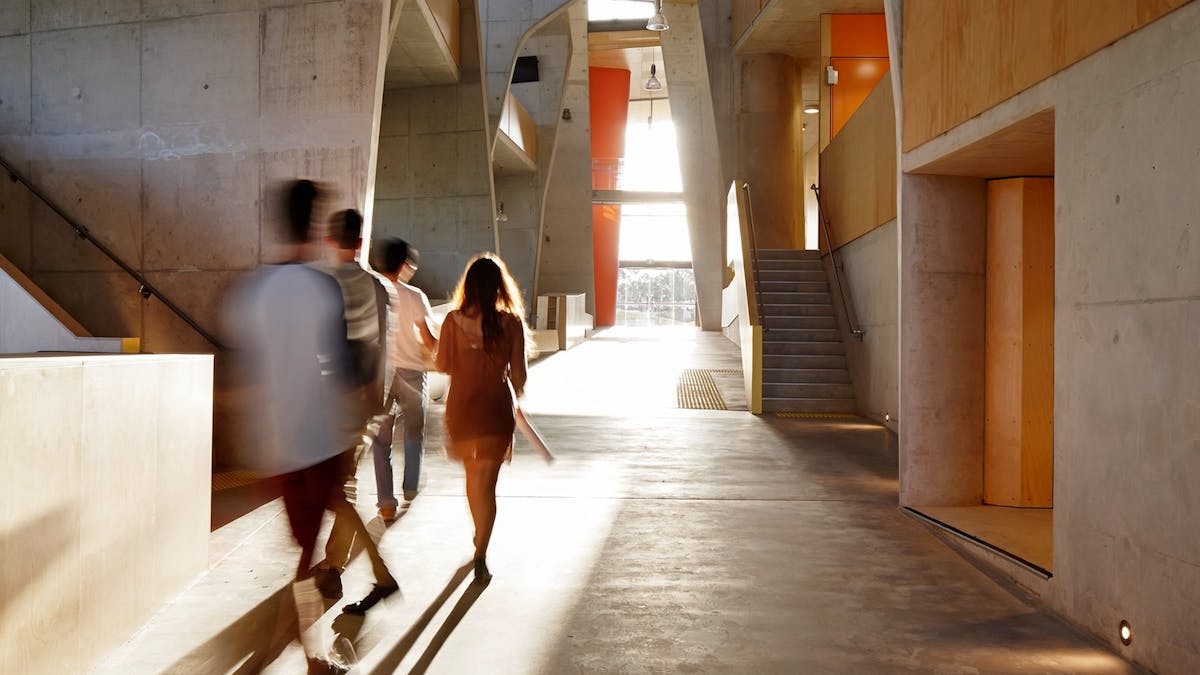 People walking through a building