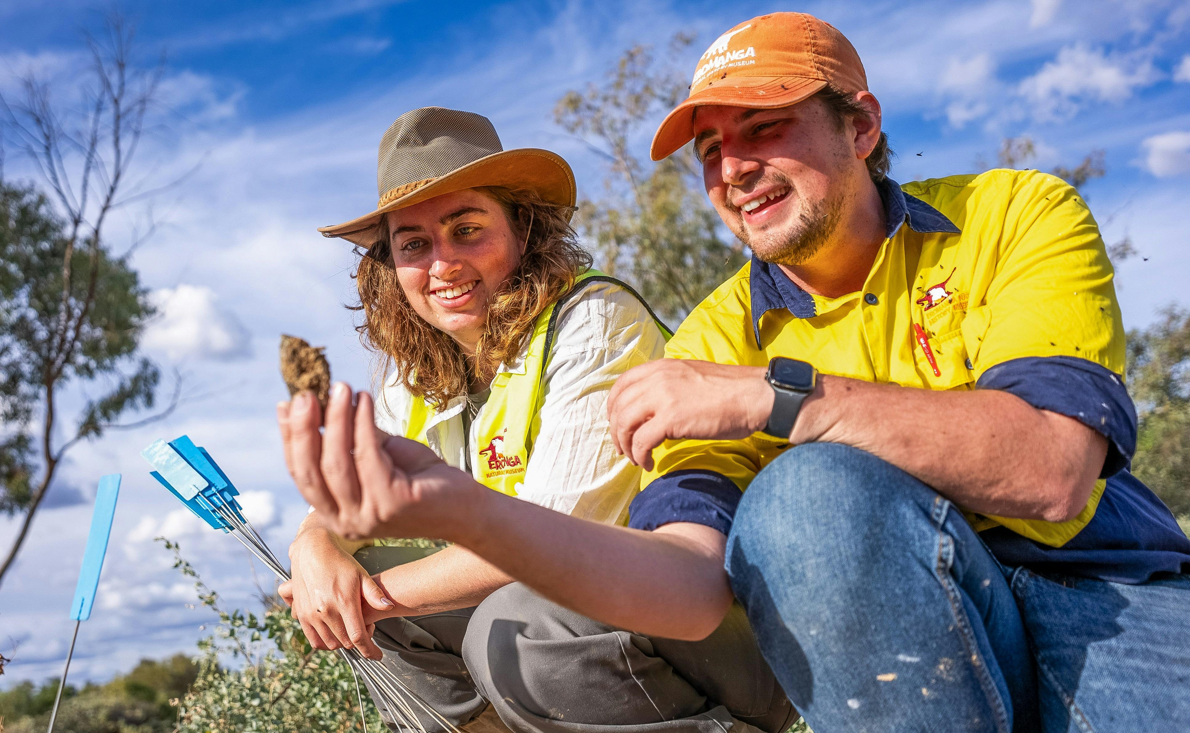 Two people finding fossils on an Eromanga Natural History Museum Megafauna Dig