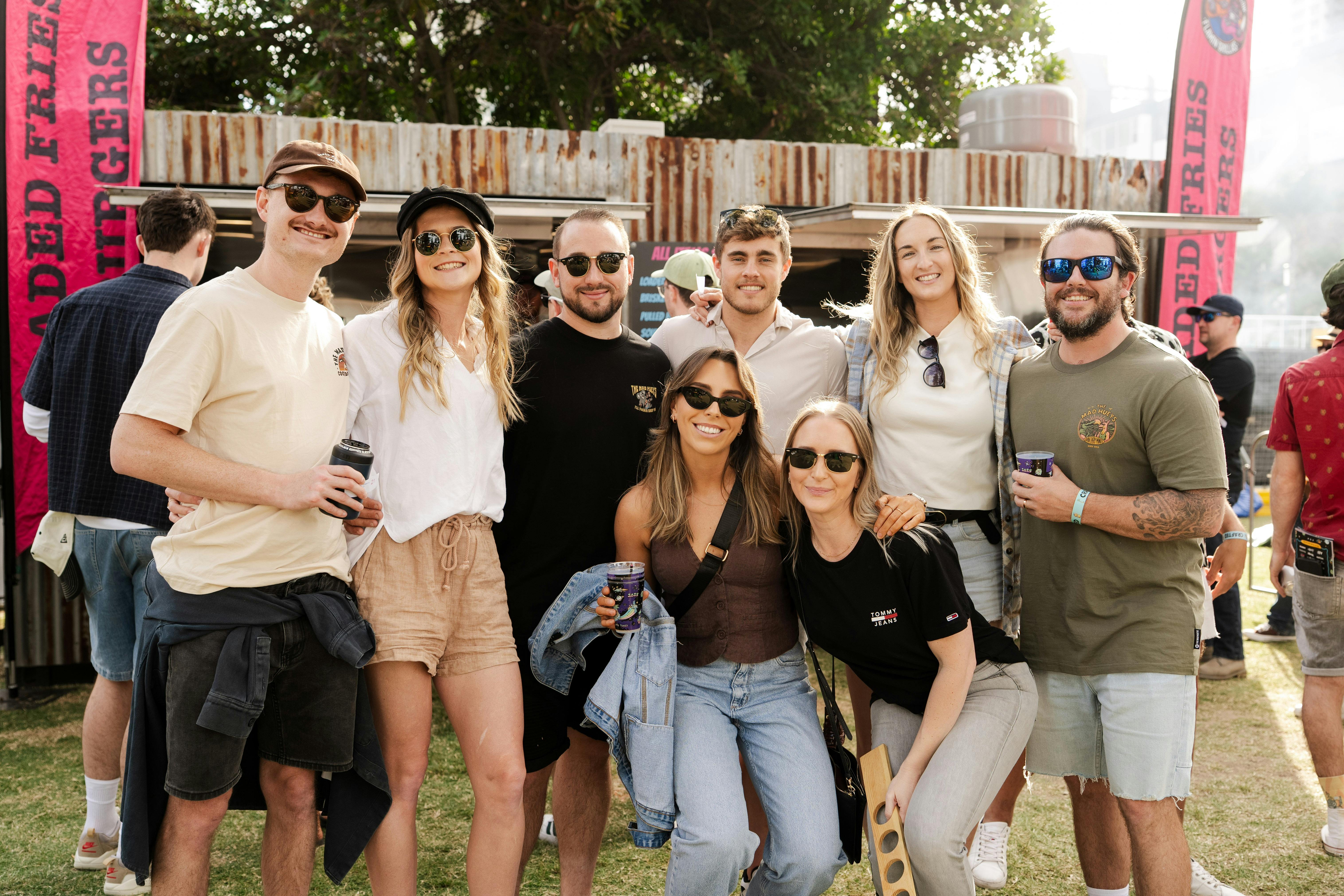 A group of people smiling at the camera at the festival