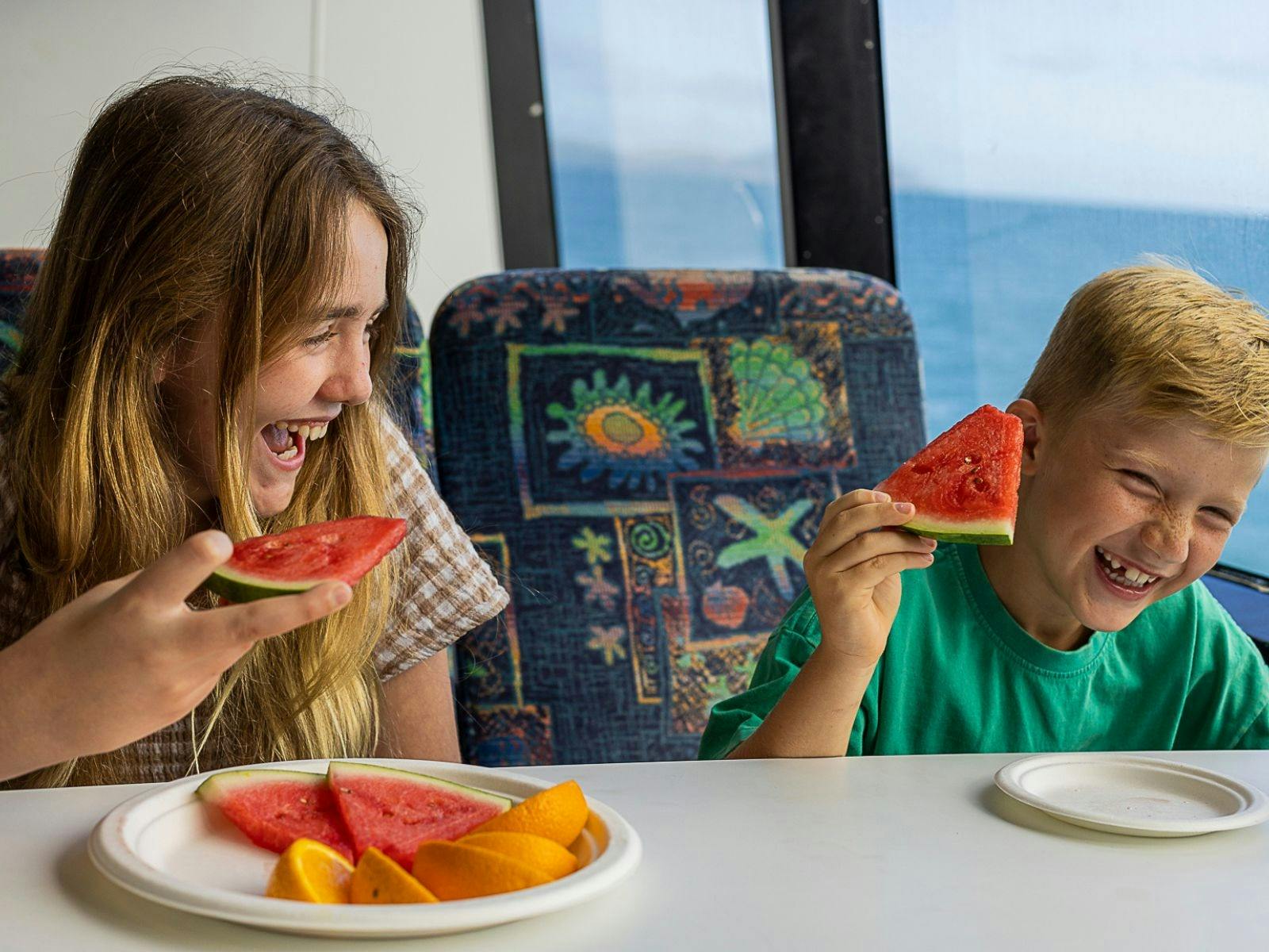 Kids enjoying morning tea on board