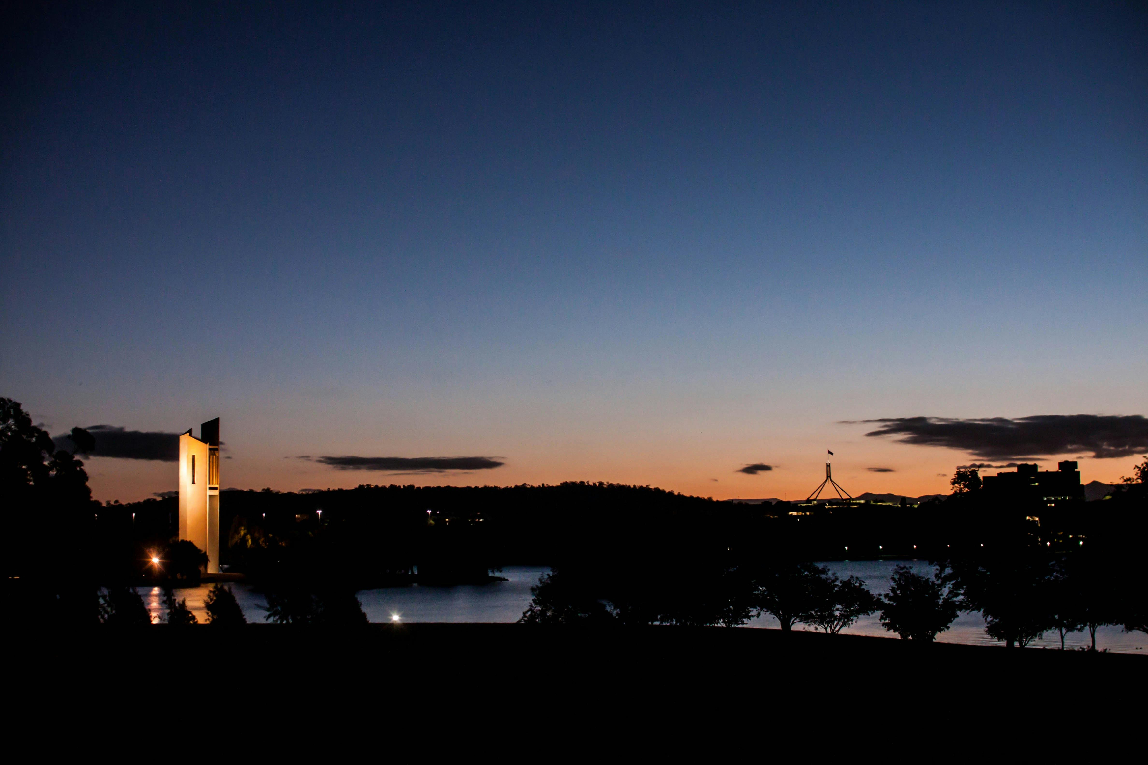 Canberra at sunset showing the Carillon bell tower and Parliament House