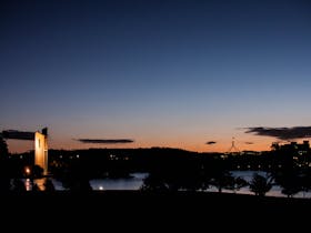 Canberra at sunset showing the Carillon bell tower and Parliament House